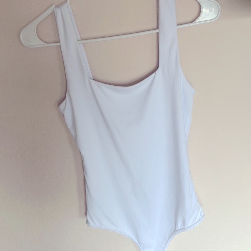 White body suit. Size S